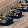 4/6/1989, Tiananmen Square, Beijing, China. Charlie Cole, USA, Newsweek. A demonstrator confronts a line of People's Liberation Army tanks during protests for democratic reform.