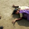 28/12/2004, Cuddalore, Tamil Nadu, India. Arko Datta, India, Reuters. A woman mourns a relative killed in the tsunami. On December 26, a 9.3 magnitude earthquake off the coast of Sumatra, Indonesia, triggered a series of deadly waves that traveled across the Indian Ocean, wreaking havoc in nine Asian countries, and causing fatalities as far away as Somalia and Tanzania. The quake was so strong that it altered the tilt of the planet by 2.5cm. More than 200,000 people died or were reported missing, and millions were left destitute in the worst natural disaster in living memory. In India, the fishing communities in Tamil Nadu were among the worst hit, with homes, lives and livelihoods being wiped away.