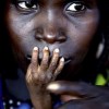 1/8/2005, Tahoua, Niger. Finbarr O'Reilly, Canada/Reuters. The fingers of malnourished Alassa Galisou (1) are pressed against the lips of his mother Fatou Ousseini at an emergency feeding center. One of the worst droughts in recent times, together with a particularly heavy plague of locusts that had destroyed the previous year's harvest, left millions of people severely short of food. Heavy rains promised well for the 2005 crops, but hindered aid workers bringing supplies. Relief had been slow to come. Accusations were leveled variously blaming the United Nations, Western governments, the international aid community and officials in Niger itself for failing to respond early enough to an imminent crisis.