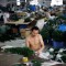 Employee makes plastic Christmas trees at the Zhongsheng Christmas Crafts factory in Yiwu