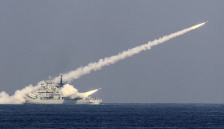 File photo shows guided missiles being launched during a drill of the North Sea Fleet in Qingdao